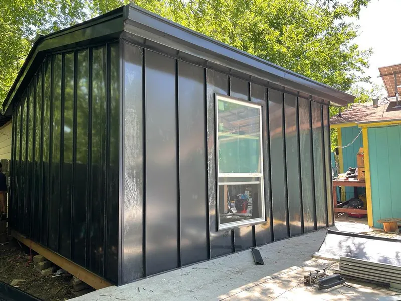 Black standing seam metal wall panels for Roof Inspection in Burton