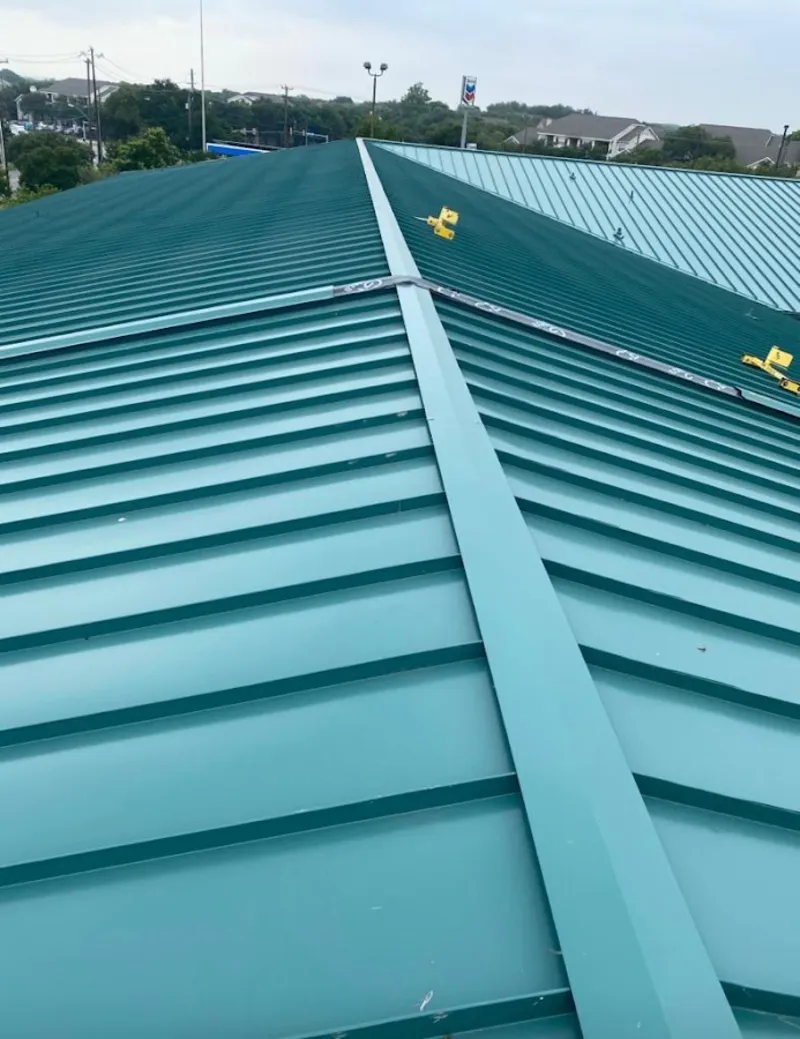 Green commercial metal roof ridge and valley for Metal Roof Repair in Burton